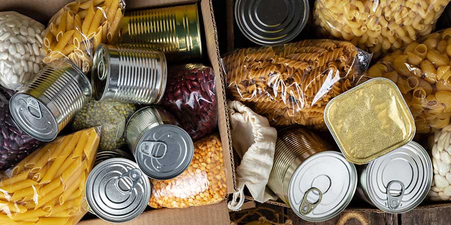 Box of donated food, cans, pasta