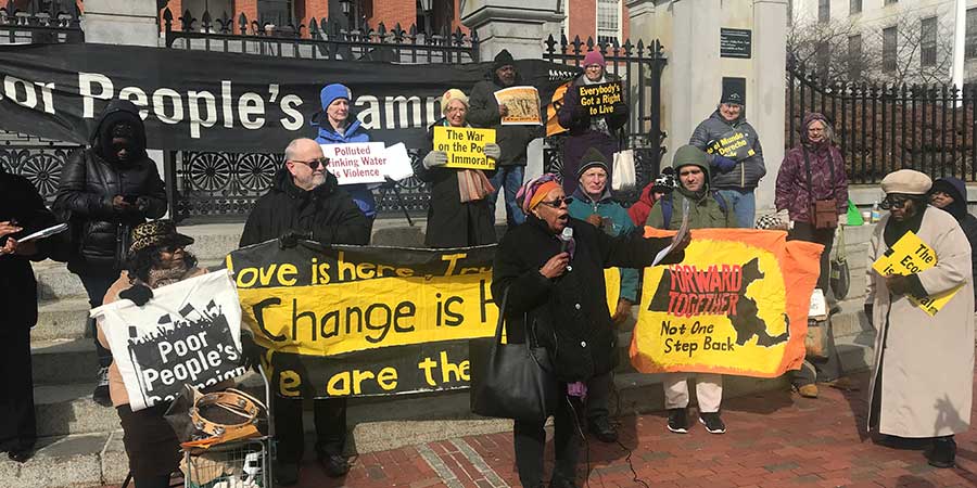 Speaker at rally in front of the Massachusetts State House for the Poor People's Campaign
